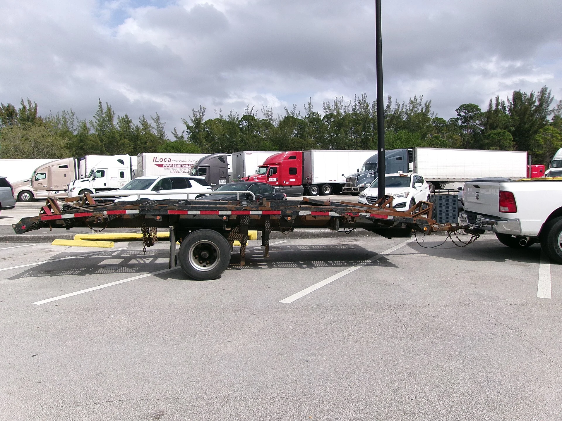 A full-size pickup truck towing a trailer, the use case that decides this comparison
